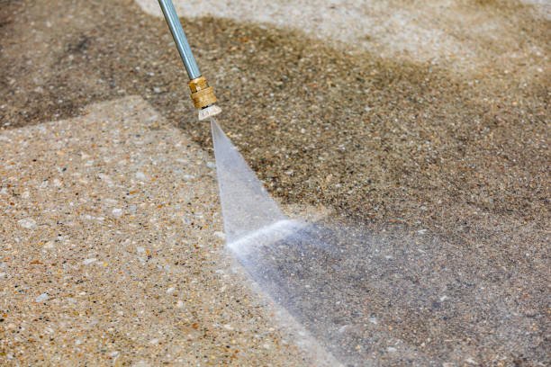 Pressure washing a driveway